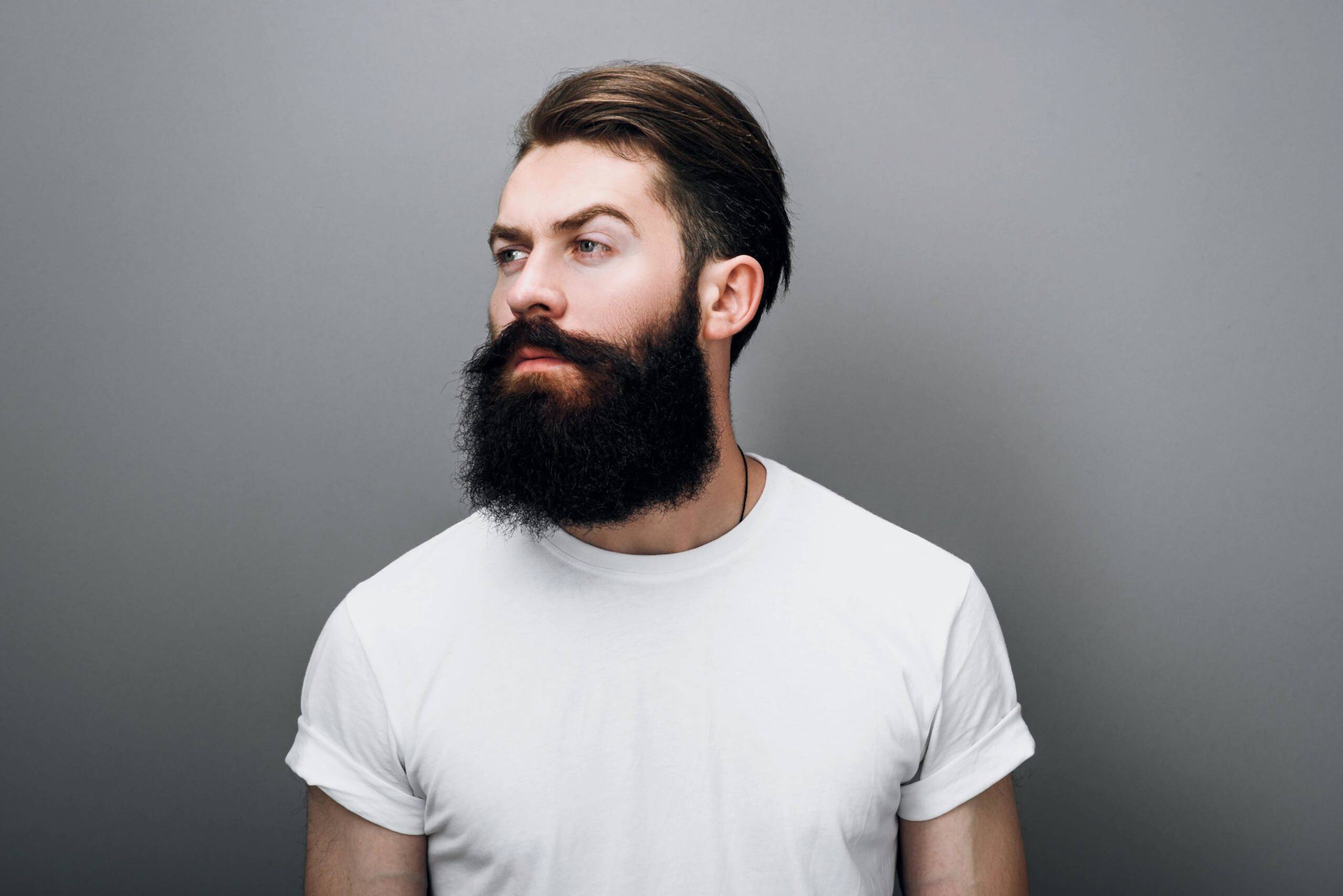 Portrait of young man with thick beard